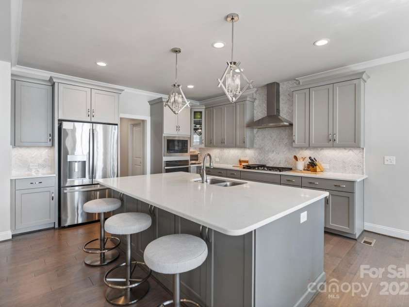20601 Island Forest Drive, Cornelius, NC 28031.  MLS# CAR4232070, YatesRealty ID 7997. Useful storage within the island and walk-in pantry