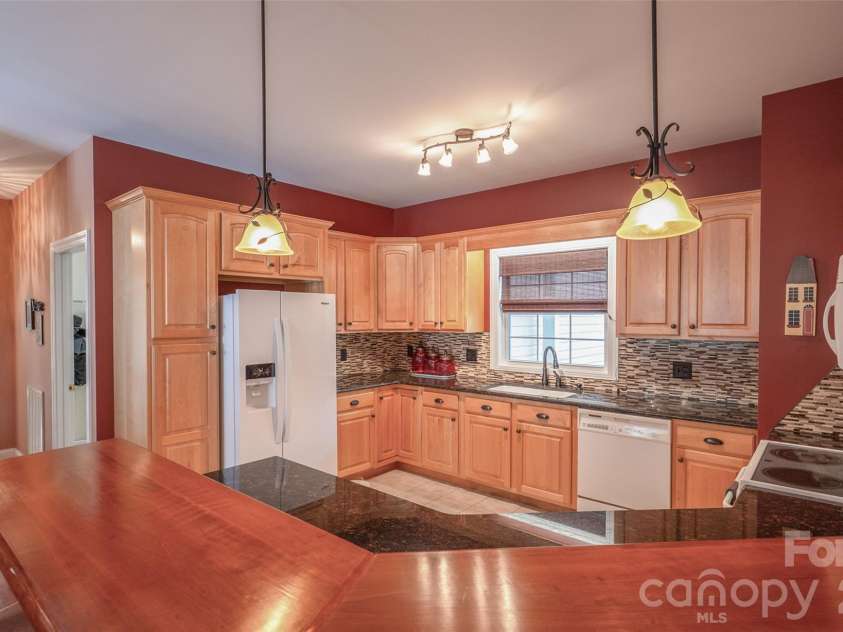 102 Fish Hawk Drive, Hendersonville, NC 28739.  MLS# CAR4360924, YatesRealty ID 8002. Kitchen has plenty of counterspace for dinner prep