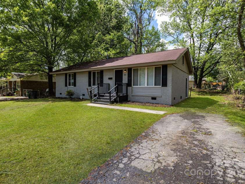 801 Bilmark Avenue, Charlotte, NC 28213.  MLS# CAR4247710, YatesRealty ID 8010. Front of home angled left, emphasis on driveway.
