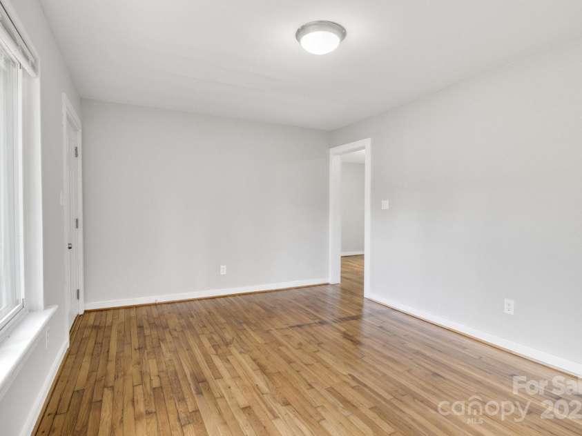 801 Bilmark Avenue, Charlotte, NC 28213.  MLS# CAR4247710, YatesRealty ID 8010. Living room immediately walking in. Open entryway leads to kitchen and dining area.
