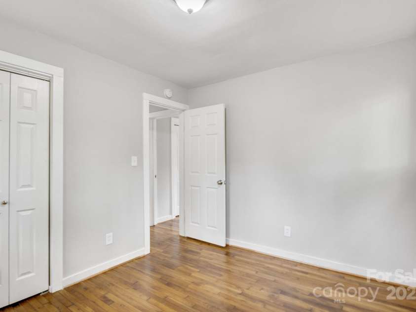 801 Bilmark Avenue, Charlotte, NC 28213.  MLS# CAR4247710, YatesRealty ID 8010. Second bedroom facing entry door.