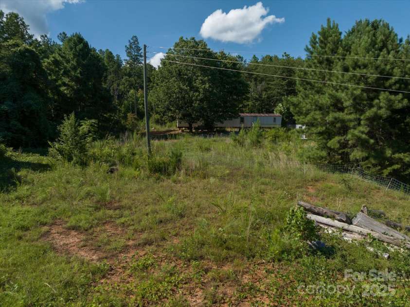 823 Silver Creek Road, Mill Spring, NC 28756.  MLS# CAR4061627, YatesRealty ID 8011. Old MH on property