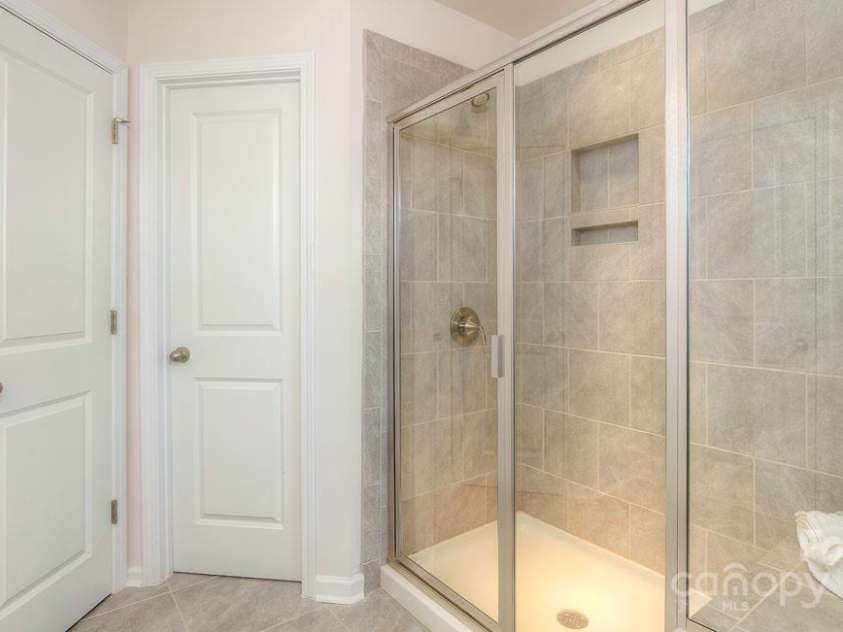 323 Creekview Road, Hendersonville, NC 28792.  MLS# CAR4176636, YatesRealty ID 8012. Shower and Toilet Room