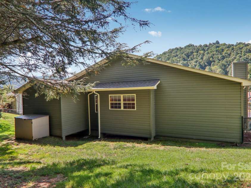 126 Pasco Loop, Waynesville, NC 28785.  MLS# CAR4301663, YatesRealty ID 8018. Back of home
