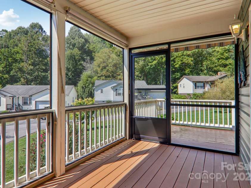 126 Pasco Loop, Waynesville, NC 28785.  MLS# CAR4301663, YatesRealty ID 8018. Screened in porch leading to additional deck