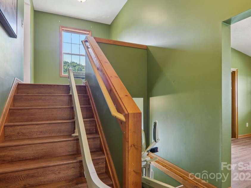 126 Pasco Loop, Waynesville, NC 28785.  MLS# CAR4301663, YatesRealty ID 8018. Steps to upstairs - stair assist can be removed