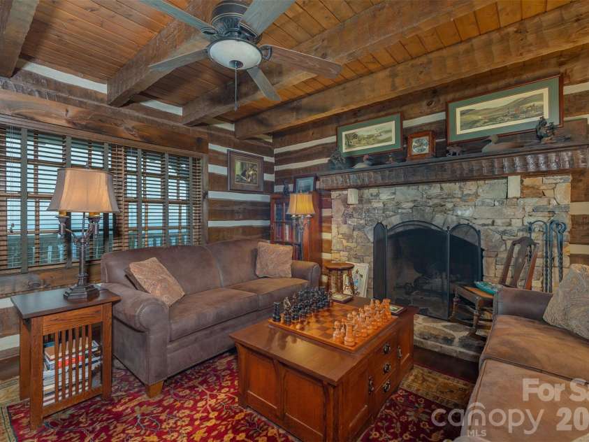 143 Daniel Boone Trail, Burnsville, NC 28714.  MLS# CAR4261449, YatesRealty ID 802. Hearthstone timbers and gorgeous stone fireplace make the perfect mountain retreat