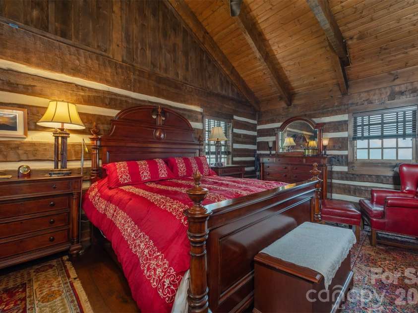 143 Daniel Boone Trail, Burnsville, NC 28714.  MLS# CAR4261449, YatesRealty ID 802. Massive second level bedroom with stunning vaulted ceilings