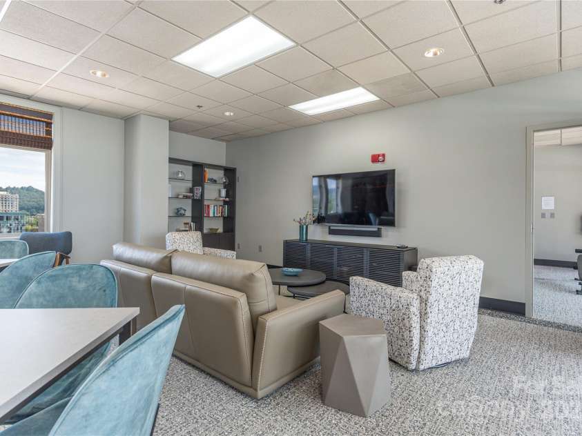 21 Battery Park Avenue, Asheville, NC 28801.  MLS# CAR4317876, YatesRealty ID 802. Social Lounge on Penthouse level
