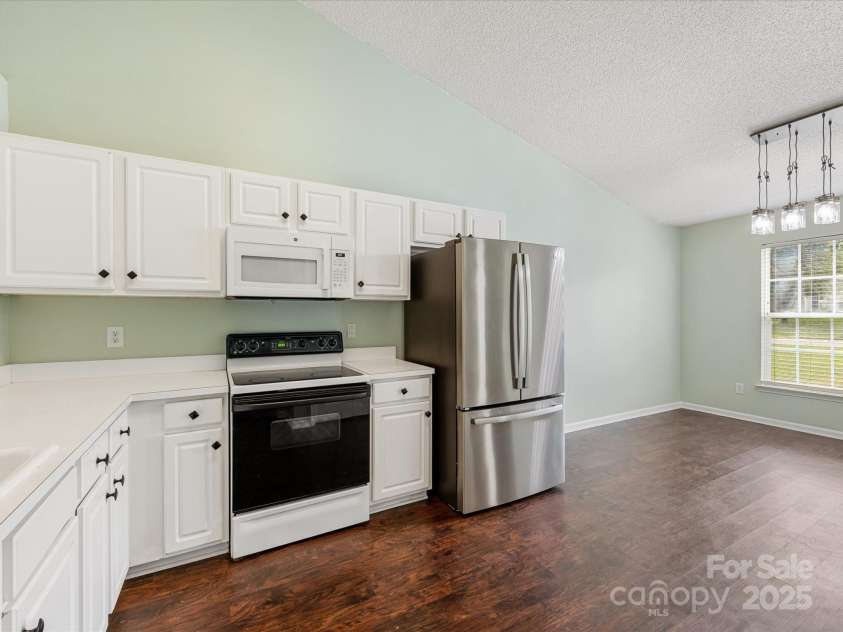 3022 Willamette Valley Drive, Charlotte, NC 28215.  MLS# CAR4248066, YatesRealty ID 8020. Kitchen (fridge included)