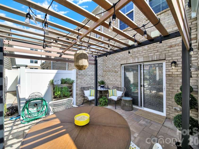 6946 Walnut Branch Lane, Charlotte, NC 28277.  MLS# CAR4298180, YatesRealty ID 8026. Back patio oasis! 