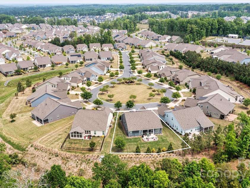 7549 Short Putt Court, Charlotte, NC 28215.  MLS# CAR4248938, YatesRealty ID 8028. A rare gem in 55+ living! Situated on a one-of-a-kind PREMIUM homesite in a private cul-de-sac—with no neighbors in front or behind—Truly a rare find!
