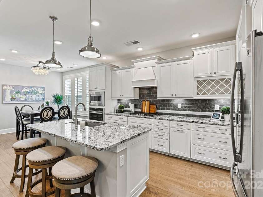 7549 Short Putt Court, Charlotte, NC 28215.  MLS# CAR4248938, YatesRealty ID 8028. Calling all chefs! The Gourmet Kitchen is a dream come true—gorgeous fixtures, sleek undermount lighting, and soft-close doors & drawers. Cooking here is pure heaven!