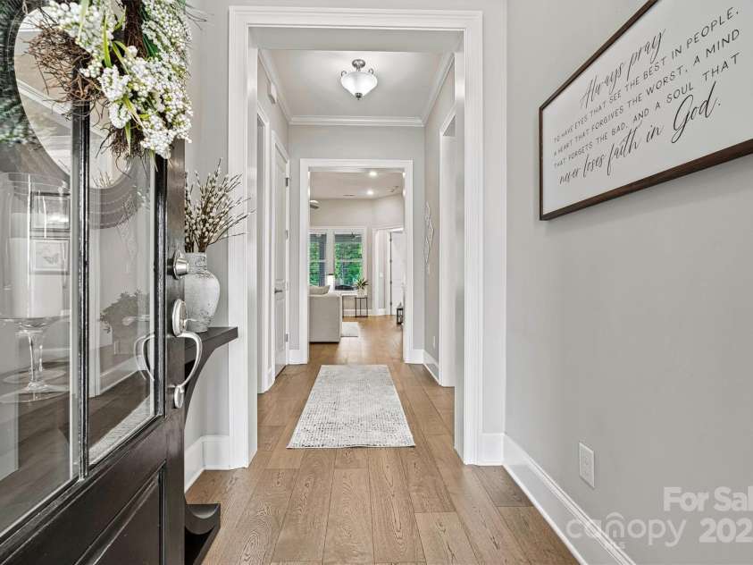 7549 Short Putt Court, Charlotte, NC 28215.  MLS# CAR4248938, YatesRealty ID 8028. Cue the WOW factor! This breathtaking foyer stuns with Level 5 wood floors, custom paint, and elegant crown molding and upgraded baseboards that set the tone for the entire home.