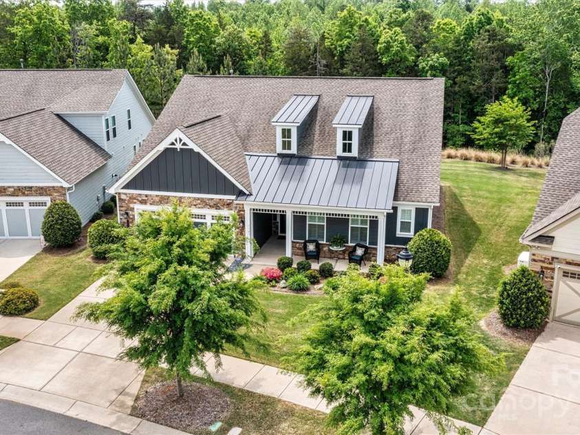 7549 Short Putt Court, Charlotte, NC 28215.  MLS# CAR4248938, YatesRealty ID 8028. Nestled on one of Cresswind Charlotte’s most sought-after streets — with peaceful privacy and no neighbors in front or behind. Your serene escape awaits!