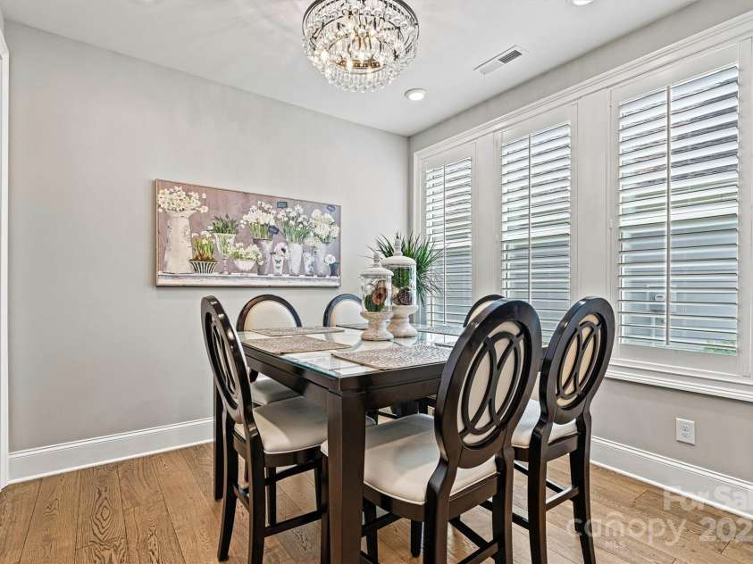 7549 Short Putt Court, Charlotte, NC 28215.  MLS# CAR4248938, YatesRealty ID 8028. Plantation shutters, upgraded neutral paint, and rich wood flooring make this separate breakfast area the perfect blend of style and comfort.