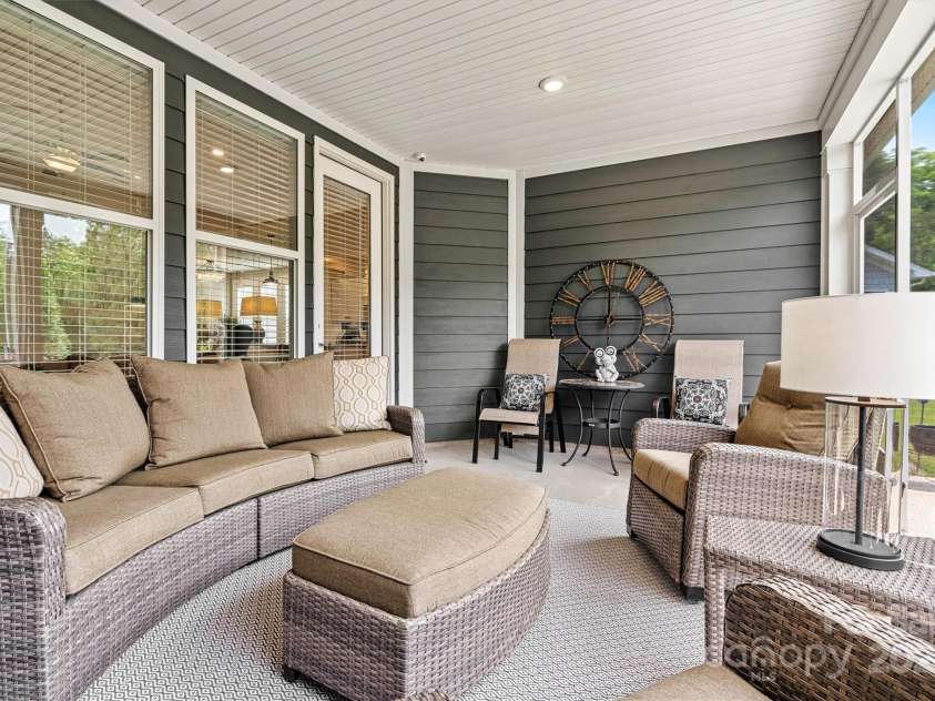 7549 Short Putt Court, Charlotte, NC 28215.  MLS# CAR4248938, YatesRealty ID 8028. Rain or shine, the party’s on! The spacious covered screened porch offers the perfect spot to entertain family and friends while soaking in serene views of nature.