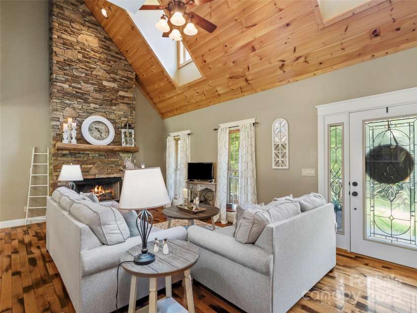 35 Lands End Drive, Burnsville, NC 28714.  MLS# CAR4221215, YatesRealty ID 803. Beautiful stone fireplace, cathedral ceilings and gorgeous hickory hardwood floors