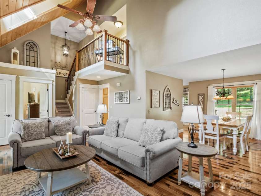 35 Lands End Drive, Burnsville, NC 28714.  MLS# CAR4221215, YatesRealty ID 803. Living room and open dining room space