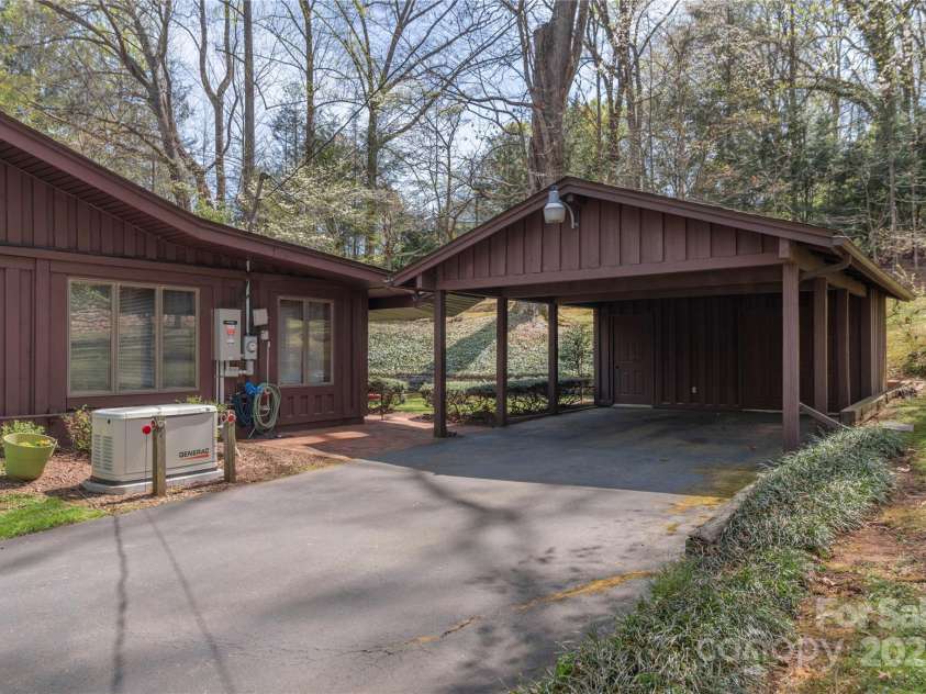 22 Waynewood Drive, Waynesville, NC 28786.  MLS# CAR4249792, YatesRealty ID 8033. 2 car carport with storage