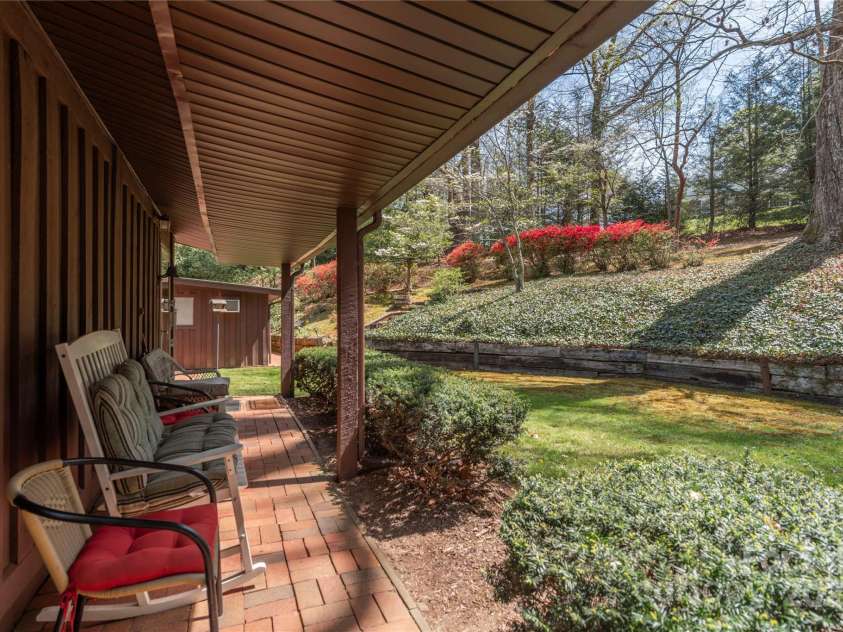22 Waynewood Drive, Waynesville, NC 28786.  MLS# CAR4249792, YatesRealty ID 8033. Back covered patio breezeway to carport