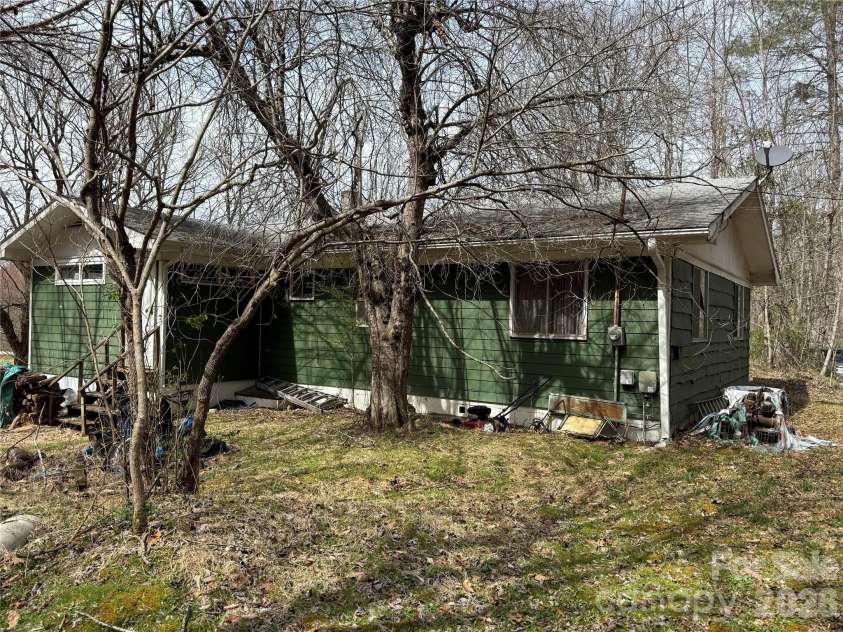 57 Fork Road, Barnardsville, NC 28709.  MLS# CAR4334387, YatesRealty ID 8038. Hardi-plank siding on back side of home.