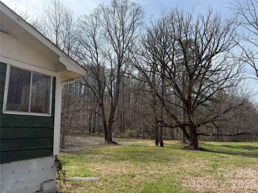 57 Fork Road, Barnardsville, NC 28709.  MLS# CAR4334387, YatesRealty ID 8038. Side Yard.