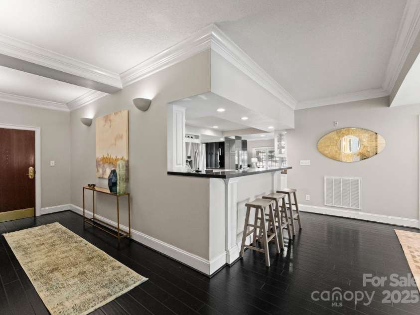 2445 Selwyn Avenue, Charlotte, NC 28209.  MLS# CAR4234376, YatesRealty ID 8039. Kitchen to bar area