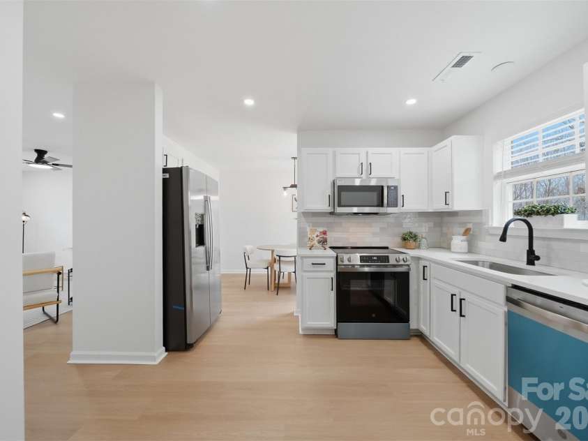 1494 Kindred Circle, Concord, NC 28027.  MLS# CAR4351536, YatesRealty ID 8040. 14 Kitchen access to the dining room.