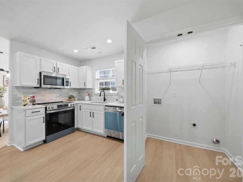 1494 Kindred Circle, Concord, NC 28027.  MLS# CAR4351536, YatesRealty ID 8040. 17 Double door laundry room space accommodating stand-alone washer and dryer.
