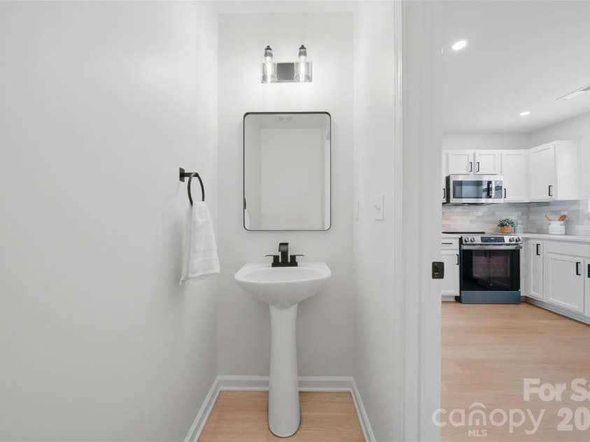 1494 Kindred Circle, Concord, NC 28027.  MLS# CAR4351536, YatesRealty ID 8040. 18 Downstairs guest half-bath.