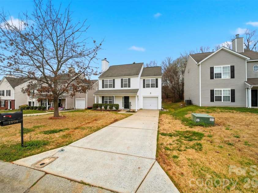 1494 Kindred Circle, Concord, NC 28027.  MLS# CAR4351536, YatesRealty ID 8040. 30 Driveway entry providing  space for vehicular parking, accommodating both resident vehicles and guest parking.