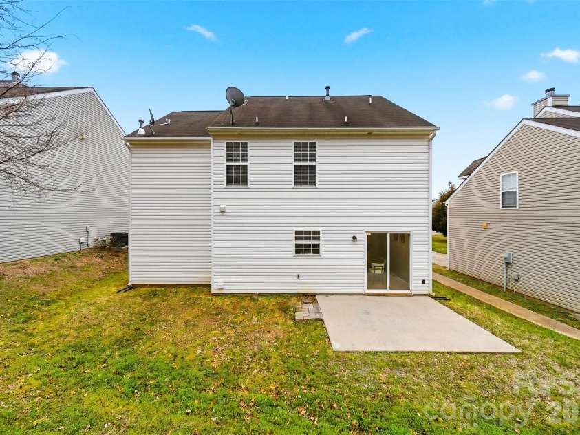 1494 Kindred Circle, Concord, NC 28027.  MLS# CAR4351536, YatesRealty ID 8040. 31 Spacious backyard with a concrete pad suitable for a patio set.