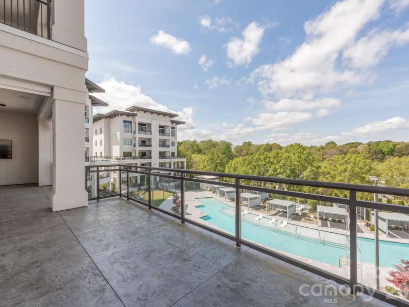 19329 Watermark Drive, Cornelius, NC 28031.  MLS# CAR4366392, YatesRealty ID 8051. Uncovered Lanai area overlooking the pool