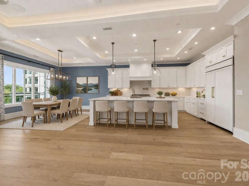 19329 Watermark Drive, Cornelius, NC 28031.  MLS# CAR4366392, YatesRealty ID 8051. Virtually staged big view of kitchen and dining