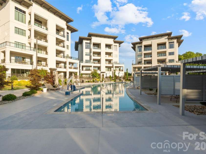 19329 Watermark Drive, Cornelius, NC 28031.  MLS# CAR4406294, YatesRealty ID 8051. Stunning pool with cabanas.