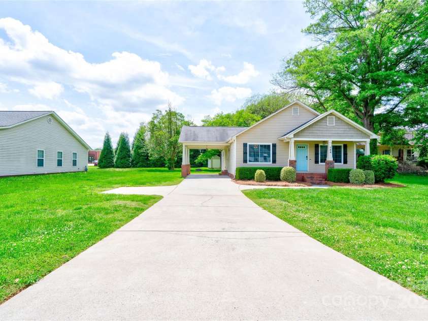 704 Catawba Street, Belmont, NC 28012.  MLS# CAR4249281, YatesRealty ID 8057. Carport, parking pad, and driveway combined will accommodate up to four (average) vehicles comfortably