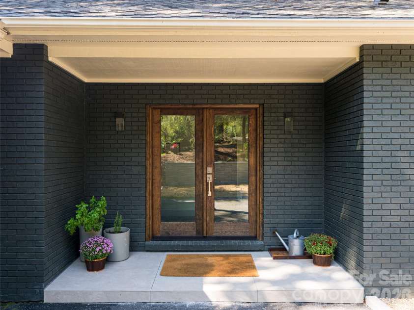 17 Beaverdam Court, Asheville, NC 28804.  MLS# CAR4346866, YatesRealty ID 8068. Mid-century modern vibe at front door 