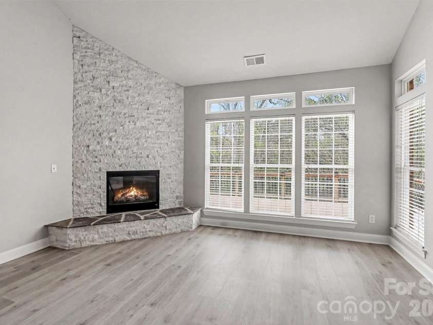 2326 Donnington Lane, Concord, NC 28027.  MLS# CAR4356967, YatesRealty ID 8071. Showstopper!  Beautiful dramatic stacked stone creates a stunning backdrop for the fireplace.  Neutral Flooring and Fresh Paint.  Lots of windows for natural lighting. 2 Story Great Room.