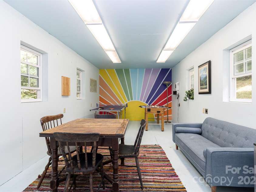 255 Chestnut Hill Road, Burnsville, NC 28714.  MLS# CAR4173831, YatesRealty ID 8073. An outbuilding, complete with power, stands ready to be transformed into a studio or workshop.