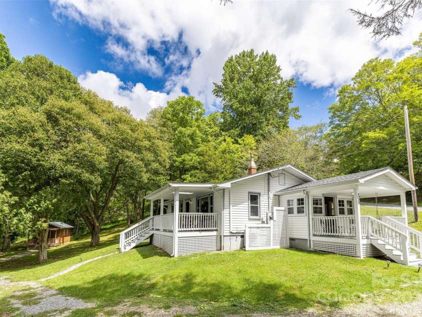 255 Chestnut Hill Road, Burnsville, NC 28714.  MLS# CAR4173831, YatesRealty ID 8073. The perfect blend of solitude and accessibility, you’ll feel worlds away from the hustle and bustle, but you’re just 45 minutes from Asheville and an hour from Johnson City.
