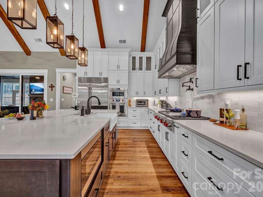 1619 Ellis Belk Road, Monroe, NC 28112.  MLS# CAR4299697, YatesRealty ID 8075. Chef's delight Kitchen w/custom floor-to-ceiling cabinets and quartz countertops. Wolf, Sub-Zero appliances.