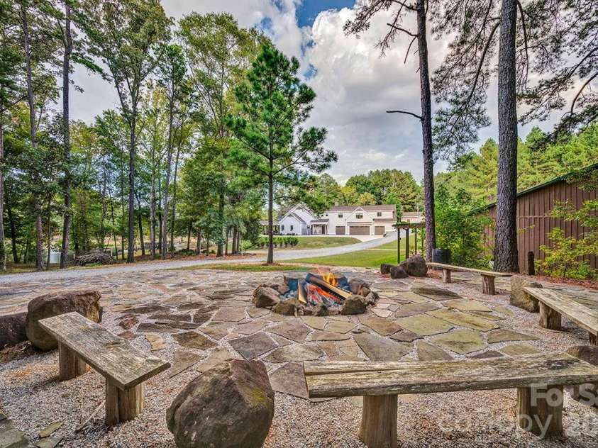 1619 Ellis Belk Road, Monroe, NC 28112.  MLS# CAR4299697, YatesRealty ID 8075. Firepit for small and large groups.