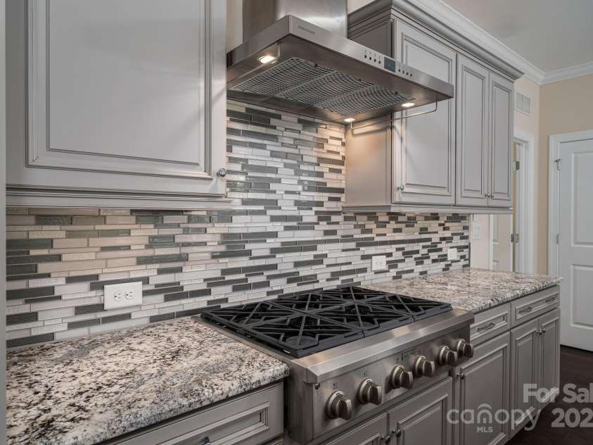 286 Hemlock Bluff Court, Denver, NC 28037.  MLS# CAR4249984, YatesRealty ID 8075. GE Monogram 6 burner gas cooktop & vent