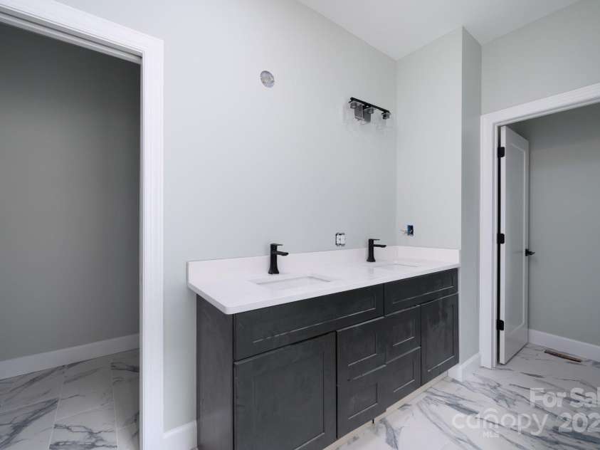 258 Whitfield Lane, Weaverville, NC 28787.  MLS# CAR4177778, YatesRealty ID 8079. Dual Primary Bathroom