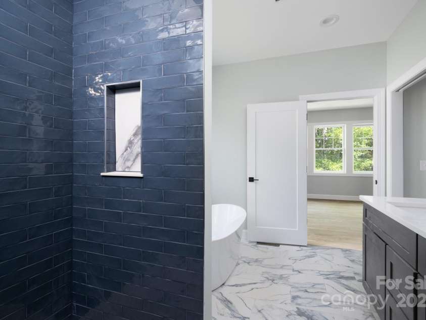 258 Whitfield Lane, Weaverville, NC 28787.  MLS# CAR4177778, YatesRealty ID 8079. Primary Bathroom Shower