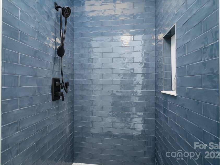 258 Whitfield Lane, Weaverville, NC 28787.  MLS# CAR4177778, YatesRealty ID 8079. Tiled Shower Surround