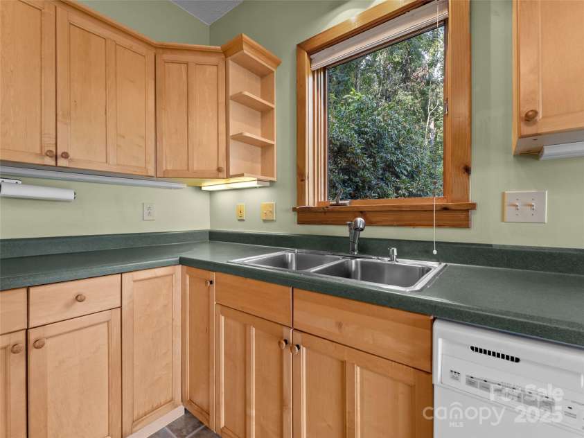 1299 Pine Ridge Road, Burnsville, NC 28714.  MLS# CAR4306270, YatesRealty ID 8091. Breathe in the mountain air while doing your dishes