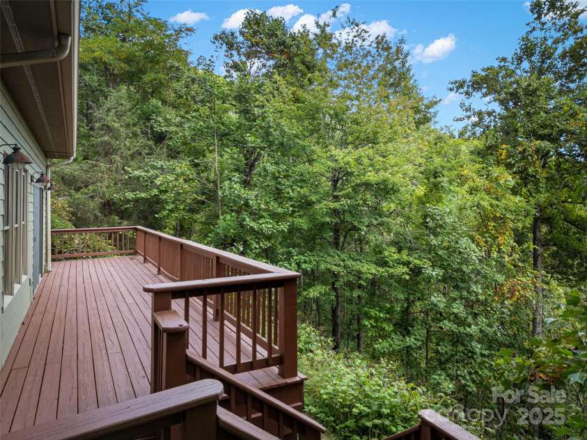 1299 Pine Ridge Road, Burnsville, NC 28714.  MLS# CAR4306270, YatesRealty ID 8091. Bring your rocking chairs and listen to the sounds of nature