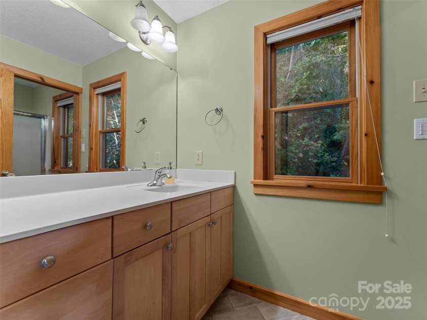 1299 Pine Ridge Road, Burnsville, NC 28714.  MLS# CAR4306270, YatesRealty ID 8091. Full hallway bathroom with large vanity space